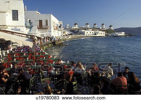 outdoor cafT, Mykonos, Greek Islands, Cyclades, Greece, Europe, Outdoor cafT at Little Venice along the waterfront of Mykonos on the Aegean Sea. View Large Photo Image Stock Image - outdoor cafT, Mykonos, Greek Islands, Cyclades, Greece, Europe, Outdoor cafT at Little Venice along the waterfront of Mykonos on the Aegean Sea.. Fotosearch