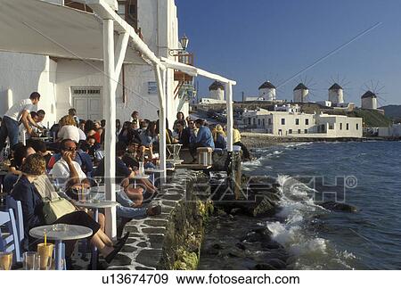outdoor cafT, Mykonos, Greek Islands, Cyclades, Greece, Europe, Outdoor cafT at Little Venice along the waterfront of Mykonos on the Aegean Sea. View Large Photo Image Stock Photo - outdoor cafT, Mykonos, Greek Islands, Cyclades, Greece, Europe, Outdoor cafT at Little Venice along the waterfront of Mykonos on the Aegean Sea.. Fotosearch