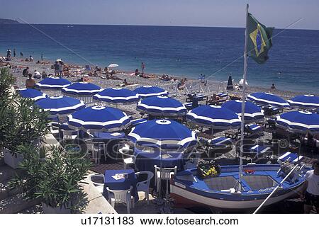 outdoor cafT, Nice, France, Cote d' Azur, Provence, Alpes-Maritimes, Europe, Outdoor restaurant along the Promenade des Anglais on the beach along the Mediterranean Sea in the city of Nice. View Large Photo Image Stock Image - outdoor cafT, Nice, France, Cote d' Azur, Provence, Alpes-Maritimes, Europe, Outdoor restaurant along the Promenade des Anglais on the beach along the Mediterranean Sea in the city of Nice. . Fotosearch
