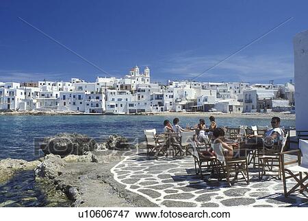 Stock Photo -  outdoor cafT, Paros, Naoussa, Greece, Greek Islands, Cyclades, Europe, Outdoor CafT along Naoussa Harbor on Paros Island on the Aegean Sea.. Fotosearch