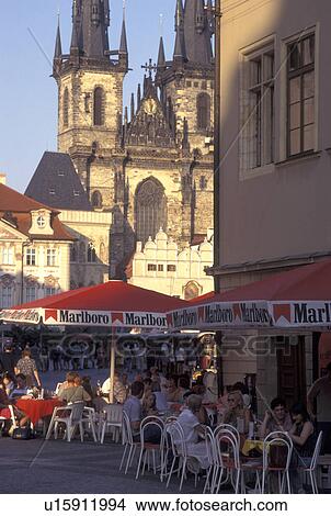 Picture -  outdoor cafT, Prague, Czech Republic, Praha, Central Bohemia, Outdoor cafT and Tyn Church in Old Town Square in the city of Prague.. Fotosearch