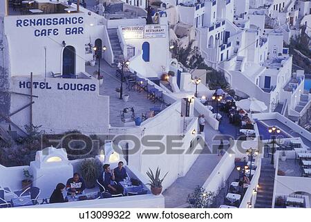 outdoor cafT, Santorini, Greece, Cyclades, Greek Islands, Fira, Europe, Outdoor restaurants in the village of Fira in the evening on the steep hillside of Santorini Island on the Aegean Sea. View Large Photo Image Stock Image - outdoor cafT, Santorini, Greece, Cyclades, Greek Islands, Fira, Europe, Outdoor restaurants in the village of Fira in the evening on the steep hillside of Santorini Island on the Aegean Sea.. Fotosearch