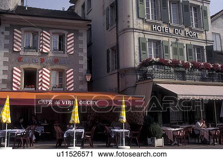 Stock Image -  outdoor cafT, Switzerland, Lausanne, Ouchy, Vaud, Outdoor cafT at CafT du Vieil Ouchy along the street in Ouchy.. Fotosearch