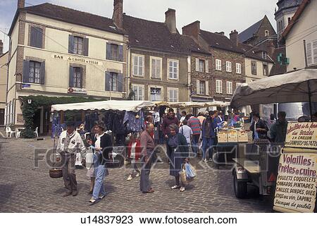Stock Image -  outdoor market, Burgundy, France, Toucy, Yonne, Bourgogne, Europe, Market Day in downtown Toucy in the region of Burgundy.. Fotosearch