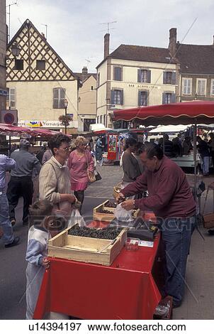 Stock Photo -  outdoor market, Burgundy, France, Toucy, Yonne, Bourgogne, Europe, Market Day in downtown Toucy in the region of Burgundy.. Fotosearch