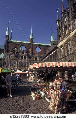 outdoor market, Germany, Lubeck, Schleswig-Holstein, Europe, Market day at Markt outside City Hall in downtown Lubeck. View Large Photo Image Stock Image - outdoor market, Germany, Lubeck, Schleswig-Holstein, Europe, Market day at Markt outside City Hall in downtown Lubeck.. Fotosearch