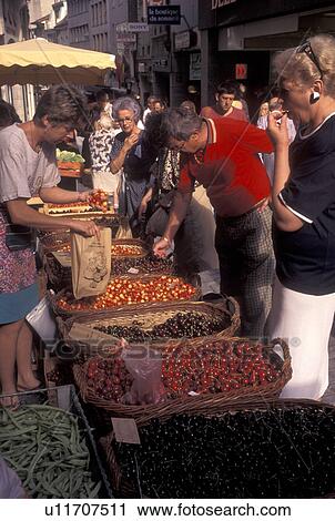 Stock Image -  outdoor market, Switzerland, Lausanne, Vaud, Cherries for sale at the street market in the city of Lausanne.. Fotosearch