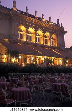Picture -  outdoor restaurant, cafT, Vienna, Austria, Wien, Outdoor restaurant at Kursalon in City Park in Vienna in the evening.. Fotosearch