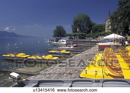 paddleboats, Switzerland, Vevey, Lake Geneva, Vaud, Yellow paddleboats docked at the lakefront park along Lac Leman in Vevey in the Canton of Vaud. View Large Photo Image Stock Photograph - paddleboats, Switzerland, Vevey, Lake Geneva, Vaud, Yellow paddleboats docked at the lakefront park along Lac Leman in Vevey in the Canton of Vaud. . Fotosearch