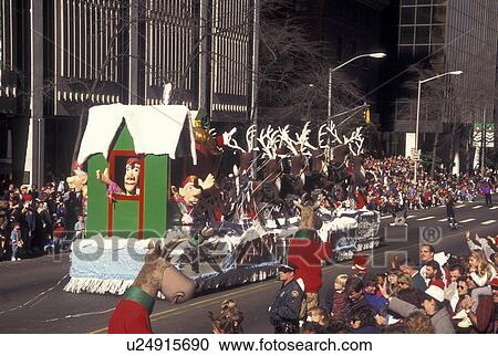 Stock Image -  parade, Christmas, Atlanta, GA, Georgia, Santa and reindeer float in the Egleston Children's Hospital Christmas Parade in downtown Atlanta.. Fotosearch