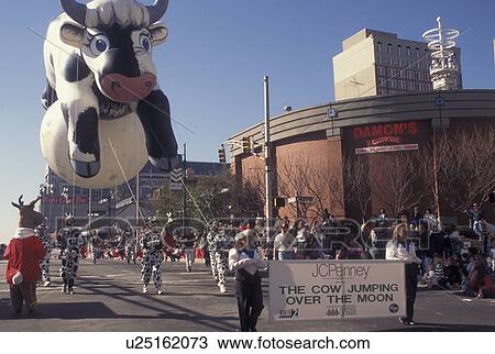 Stock Image -  parade, Christmas, Atlanta, GA, Georgia, The Cow jumped over the Moon balloon in the Egleston Children's Hospital Christmas Parade in downtown Atlanta.. Fotosearch