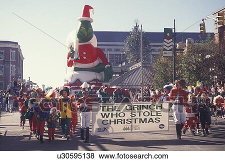 Stock Photo -  parade, Christmas, Atlanta, GA, Georgia, The Grinch Who Stole Christmas floating balloon in the Egleston Children's Hospital Christmas Parade in downtown Atlanta.. Fotosearch