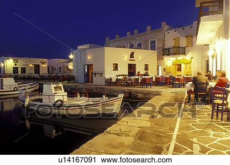 Stock Image -  Paros, Greece, Greek Islands, Naoussa, Cyclades, Europe, Waterfront on Naoussa Harbor in the evening on Paros Island on the Aegean Sea.. Fotosearch