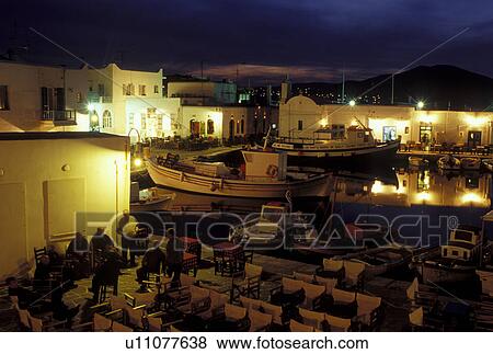 Paros, Greece, Naoussa, Greek Islands, Cyclades, Europe, Outdoor cafT on the waterfront on Naoussa Harbor in the evening on Paros Island on the Aegean Sea. View Large Photo Image Stock Photo - Paros, Greece, Naoussa, Greek Islands, Cyclades, Europe, Outdoor cafT on the waterfront on Naoussa Harbor in the evening on Paros Island on the Aegean Sea.. Fotosearch