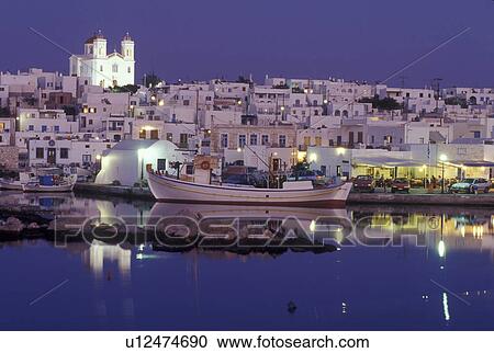 Stock Image -  Paros, Greek Islands, Naoussa, Greece, Cyclades, Europe, Fishing boats docked in Naoussa Harbor in the evening on Paros Island on the Aegean Sea.. Fotosearch