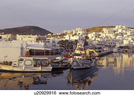 Stock Photograph -  Paros, Greek Islands, Naoussa, Greece, Cyclades, Europe, Fishing boats docked in Naoussa Harbor in the early morning on Paros Island on the Aegean Sea.. Fotosearch