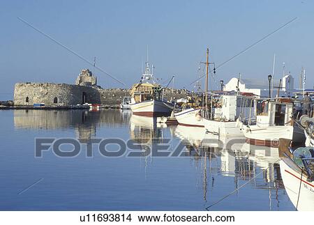 Picture -  Paros, Greek Islands, Naoussa, Cyclades, Greece, Europe, Fishing boats docked in Naoussa Harbor on Paros Island on the Aegean Sea.. Fotosearch