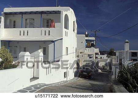 Paros, Greek Islands, Naoussa, Cyclades, Greece, Europe, Woman looking from the balcony of a whitewashed house in the town of Naoussa on Paros Island. View Large Photo Image Stock Image - Paros, Greek Islands, Naoussa, Cyclades, Greece, Europe, Woman looking from the balcony of a whitewashed house in the town of Naoussa on Paros Island.. Fotosearch