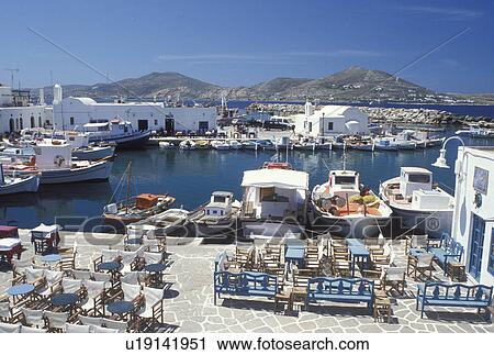 Paros, Greek Islands, Naoussa, Cyclades, Greece, Europe, Outdoor cafT on the waterfront on Naoussa Harbor on Paros Island on the Aegean Sea. View Large Photo Image Stock Image - Paros, Greek Islands, Naoussa, Cyclades, Greece, Europe, Outdoor cafT on the waterfront on Naoussa Harbor on Paros Island on the Aegean Sea.. Fotosearch