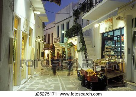 Paros, Greek Islands, Parikia, Cyclades, Greece, Europe, Shops along the narrow pedestrian streets in Plateia Mavrogenous in the evening in the town of Parikia on Paros Island. View Large Photo Image Stock Image - Paros, Greek Islands, Parikia, Cyclades, Greece, Europe, Shops along the narrow pedestrian streets in Plateia Mavrogenous in the evening in the town of Parikia on Paros Island.. Fotosearch