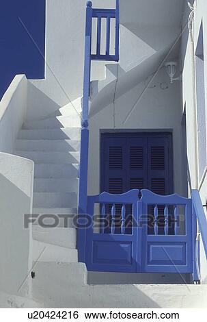Stock Photograph -  Paros, Greek Islands, Parikia, Cyclades, Greece, Europe, Typical home with whitewashed steps with blue railing and blue gate n Parikia on Paros Island.. Fotosearch