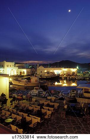 Picture -  Paros, Naoussa, Greek Islands, Greece, Cyclades, Europe, Waterfront on Naoussa Harbor in the evening on Paros Island on the Aegean Sea.. Fotosearch