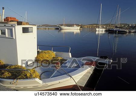 Stock Image -  Paros, Parikia, Cyclades, Greek Islands, Greece, Europe, Fishing boats docked in the harbor of Parikia on Paros Island on the Aegean Sea.. Fotosearch