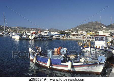 Picture -  Paros, Parikia, Greece, Greek Islands, Cyclades, Europe, Fisherman on fishing boat docked in the harbor of Parikia on Paros Island on the Aegean Sea.. Fotosearch