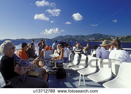 Stock Photo -  passenger ferry, St. Thomas, U. S. Virgin Islands, Charlotte Amalie, Caribbean, USVI, Passenger Ferry carries passengers to the Caribbean Islands in Charlotte Amalie Harbor in Charlotte Amalie on Saint Thomas Island.. Fotosearch