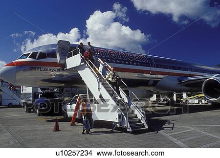 plane, St. Thomas, U. S. Virgin Islands, Caribbean, USVI, American Airlines Jet unloading passengers at the gate at Cycil E. King Airport terminal on Saint Thomas Island. View Large Photo Image Picture - plane, St. Thomas, U. S. Virgin Islands, Caribbean, USVI, American Airlines Jet unloading passengers at the gate at Cycil E. King Airport terminal on Saint Thomas Island.. Fotosearch
