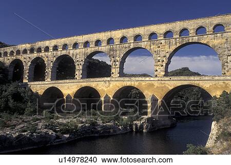 Pont du Gard, France, aqueduct, Languedoc-Roussillon, Europe, Three-tiered 19 BC Roman Aqueduct, Pont du Gard spans the Gardon River. View Large Photo Image Stock Image - Pont du Gard, France, aqueduct, Languedoc-Roussillon, Europe, Three-tiered 19 BC Roman Aqueduct, Pont du Gard spans the Gardon River.. Fotosearch