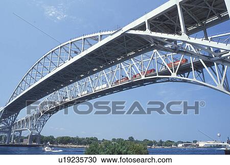 Port Huron, MI, Lake Huron, Michigan, Blue Water International Bridge spans the St. Clair River at Port Huron. View Large Photo Image Stock Image - Port Huron, MI, Lake Huron, Michigan, Blue Water International Bridge spans the St. Clair River at Port Huron.. Fotosearch