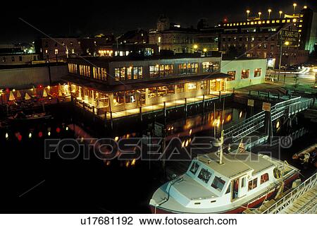 Stock Image -  Portland, ME, Maine, Aerial view of the waterfront on Portland Harbor on Casco Bay in the evening.. Fotosearch
