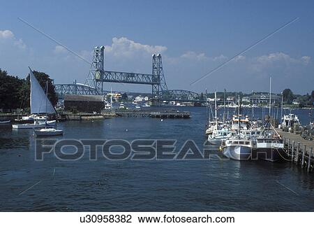 Portsmouth, NH, New Hampshire, Boats docked along the Piscataqua River in Portsmouth. View of Memorial Bridge crossing the Piscataqua River. View Large Photo Image Stock Image - Portsmouth, NH, New Hampshire, Boats docked along the Piscataqua River in Portsmouth. View of Memorial Bridge crossing the Piscataqua River.. Fotosearch