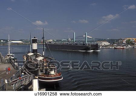 Portsmouth, NH, New Hampshire, Large barge cruises along the Piscataqua River in Portsmouth. View Large Photo Image Stock Photo - Portsmouth, NH, New Hampshire, Large barge cruises along the Piscataqua River in Portsmouth. . Fotosearch
