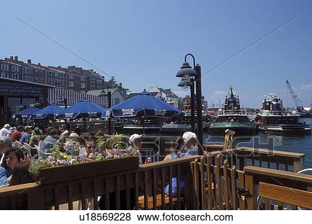 Portsmouth, NH, New Hampshire, People sitting at an outdoor cafT along the Piscataqua River in Portsmouth. View Large Photo Image Stock Photo - Portsmouth, NH, New Hampshire, People sitting at an outdoor cafT along the Piscataqua River in Portsmouth. . Fotosearch