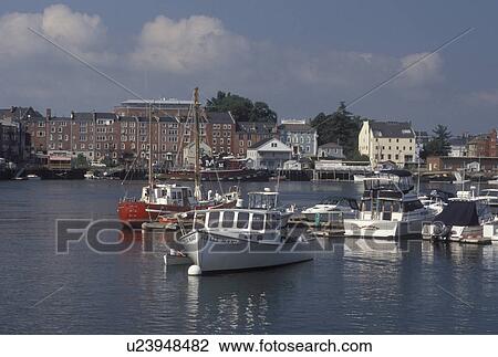 Stock Image -  Portsmouth, NH, New Hampshire, View of boats docked along the Piscataqua River in Portsmouth.. Fotosearch