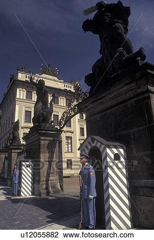 Stock Image -  Prague, Czech Republic, Praha, Central Bohemia, Europe, Guards standing at entrance to Prague Castle.. Fotosearch