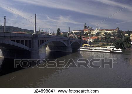 Prague, Vltava River, Czech Republic, Praha, Central Bohemia, Excursion boat cruises under a bridge on the Vltava River. View Large Photo Image Stock Photo - Prague, Vltava River, Czech Republic, Praha, Central Bohemia, Excursion boat cruises under a bridge on the Vltava River.. Fotosearch