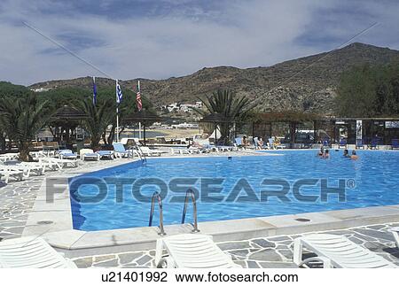 resort, Ios, Greek Islands, Cyclades, Greece, Europe, Swimming pool at a resort on Milopotas Beach on Ios Island on the Aegean Sea. View Large Photo Image Stock Image - resort, Ios, Greek Islands, Cyclades, Greece, Europe, Swimming pool at a resort on Milopotas Beach on Ios Island on the Aegean Sea.. Fotosearch