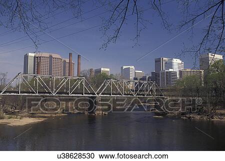 Richmond, skyline, VA, Virginia, Skyline of downtown Richmond. Railroad bridge crossing the James River. View Large Photo Image Stock Image - Richmond, skyline, VA, Virginia, Skyline of downtown Richmond. Railroad bridge crossing the James River.. Fotosearch