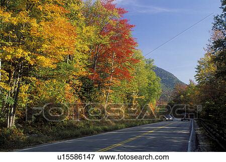 Stock Photo -  road, NH, New Hampshire, White Mountain National Forest, Merrimack River Valley, Scenic Kancamagus Highway surrounded by colorful fall foliage in the autumn in the White Mountain Nat'l Forest.. Fotosearch