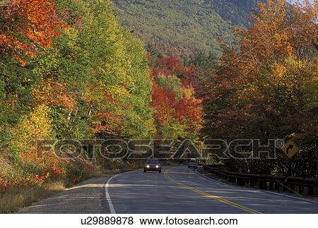 road, NH, New Hampshire, White Mountain National Forest, Merrimack River Valley, Scenic Kancamagus Highway surrounded by colorful fall foliage in the autumn in the White Mountain Nat'l Forest. View Large Photo Image Stock Photo - road, NH, New Hampshire, White Mountain National Forest, Merrimack River Valley, Scenic Kancamagus Highway surrounded by colorful fall foliage in the autumn in the White Mountain Nat'l Forest.. Fotosearch