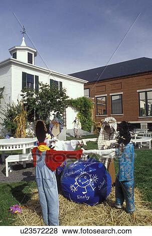 Stock Photo -  Rockland, ME, Maine, Fall decorations of scarecrows displayed outside the Farnsworth Art Museum and the Wyeth Center in the autumn.. Fotosearch