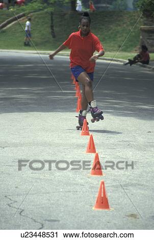 roller skating, Atlanta, GA, Georgia, African American girl roller skating around orange cones in Piedmont Park in Atlanta. View Large Photo Image Stock Image - roller skating, Atlanta, GA, Georgia, African American girl roller skating around orange cones in Piedmont Park in Atlanta.. Fotosearch