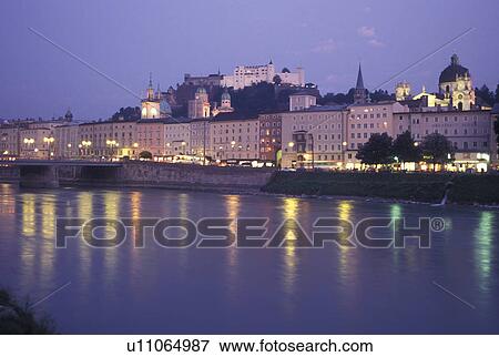 Stock Photo -  Salzburg, Austria, Salzach River, View of the city of Salzburg along the River Salzach in the evening.. Fotosearch