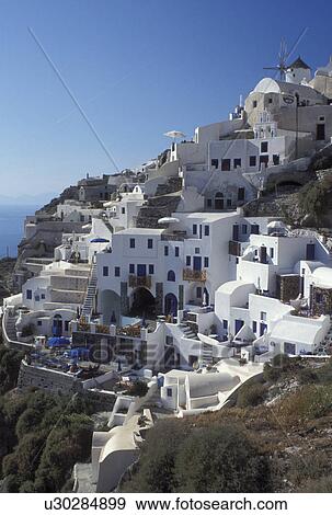 Santorini, Greece, Greek Islands, Oia, Cyclades, Europe, Resorts in the village of Oia on the steep hillside of Santorini Island on the Aegean Sea. View Large Photo Image Stock Photo - Santorini, Greece, Greek Islands, Oia, Cyclades, Europe, Resorts in the village of Oia on the steep hillside of Santorini Island on the Aegean Sea.. Fotosearch