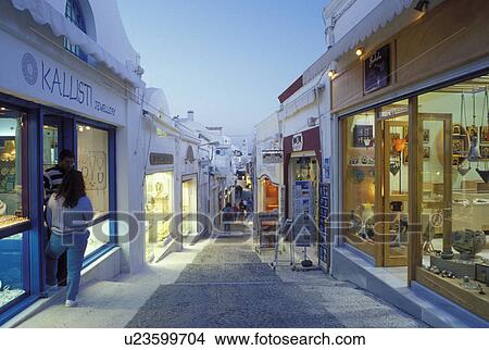 Santorini, Greece, Greek Islands, Fira, Cyclades, Europe, Shops and boutiques along a narrow pedestrian street in the village of Fira in the evening on Santorini Island on the Aegean Sea. View Large Photo Image Picture - Santorini, Greece, Greek Islands, Fira, Cyclades, Europe, Shops and boutiques along a narrow pedestrian street in the village of Fira in the evening on Santorini Island on the Aegean Sea. . Fotosearch