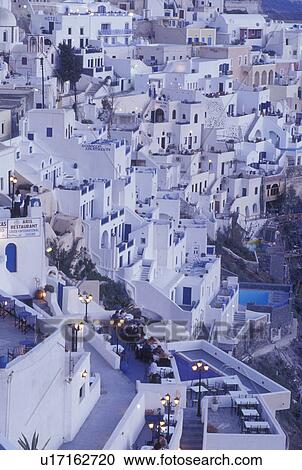 Santorini, Greece, Greek Islands, Fira, Cyclades, Europe, Outdoor restaurants and cafTs in the village of Fira in the evening on the steep hillside of Santorini Island on the Aegean Sea. View Large Photo Image Stock Image - Santorini, Greece, Greek Islands, Fira, Cyclades, Europe, Outdoor restaurants and cafTs in the village of Fira in the evening on the steep hillside of Santorini Island on the Aegean Sea.. Fotosearch
