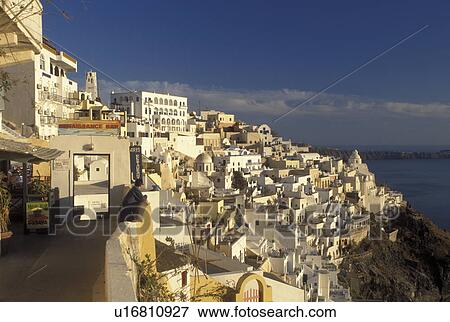 Santorini, Greece, Greek Islands, Fira, Cyclades, Europe, Terraces and resorts in the village of Fira on the steep hillside of Santorini Island overlooking the Aegean Sea. View Large Photo Image Stock Photo - Santorini, Greece, Greek Islands, Fira, Cyclades, Europe, Terraces and resorts in the village of Fira on the steep hillside of Santorini Island overlooking the Aegean Sea.. Fotosearch